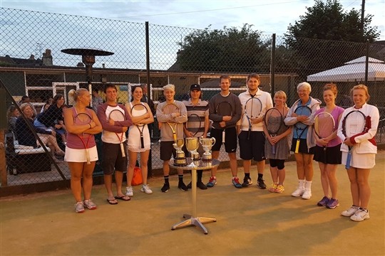 A team of tennis players on the newly resurfaced astroturf tennis courts at Bath Tennis